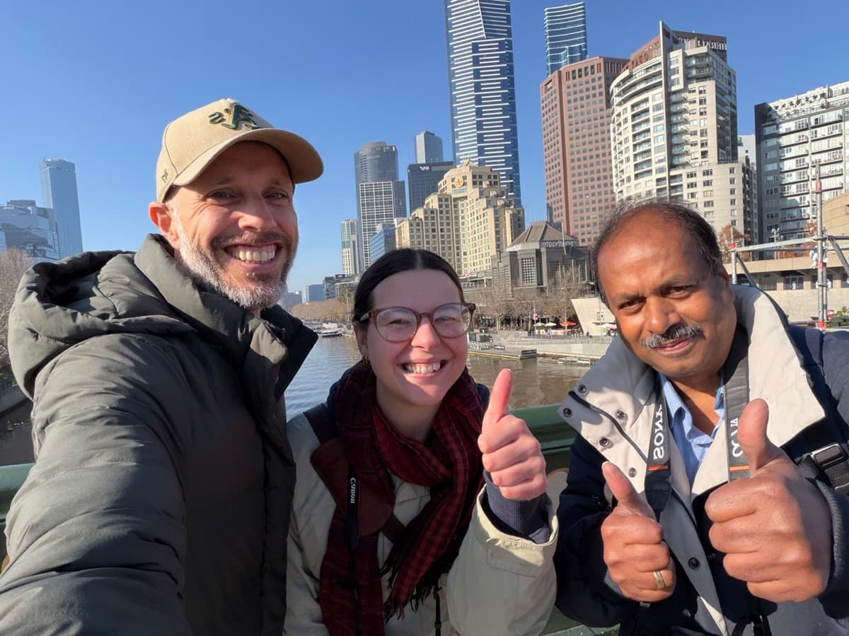 Two students and instructor Daniel Bilsborough over the Yarra during a Melbourne photography course